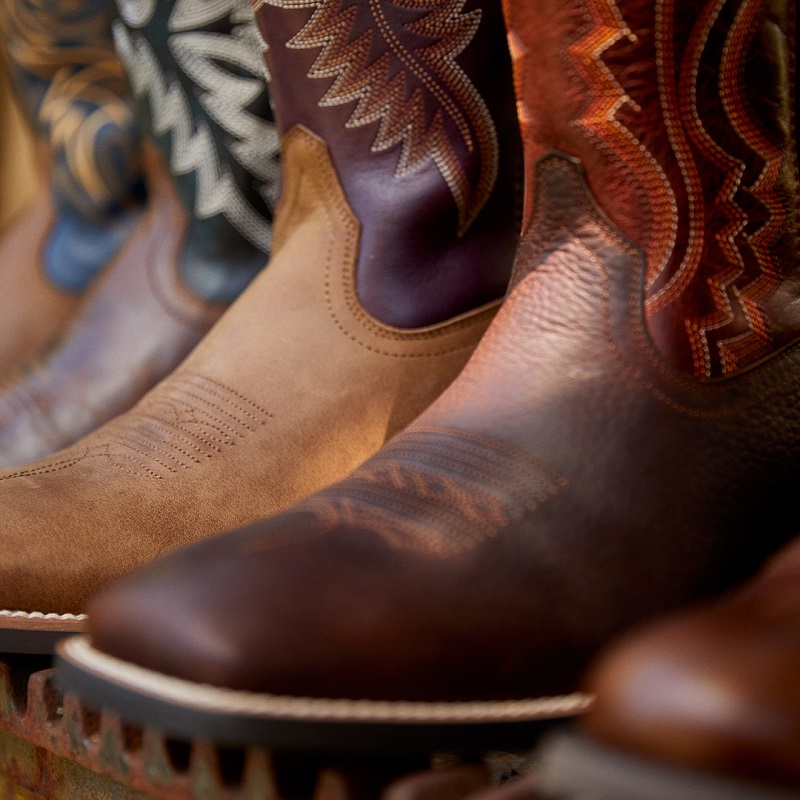 closeup of various styles of Ariat western boots