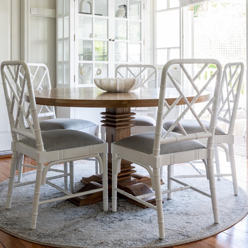 close up of a coastal style dining chairs and table